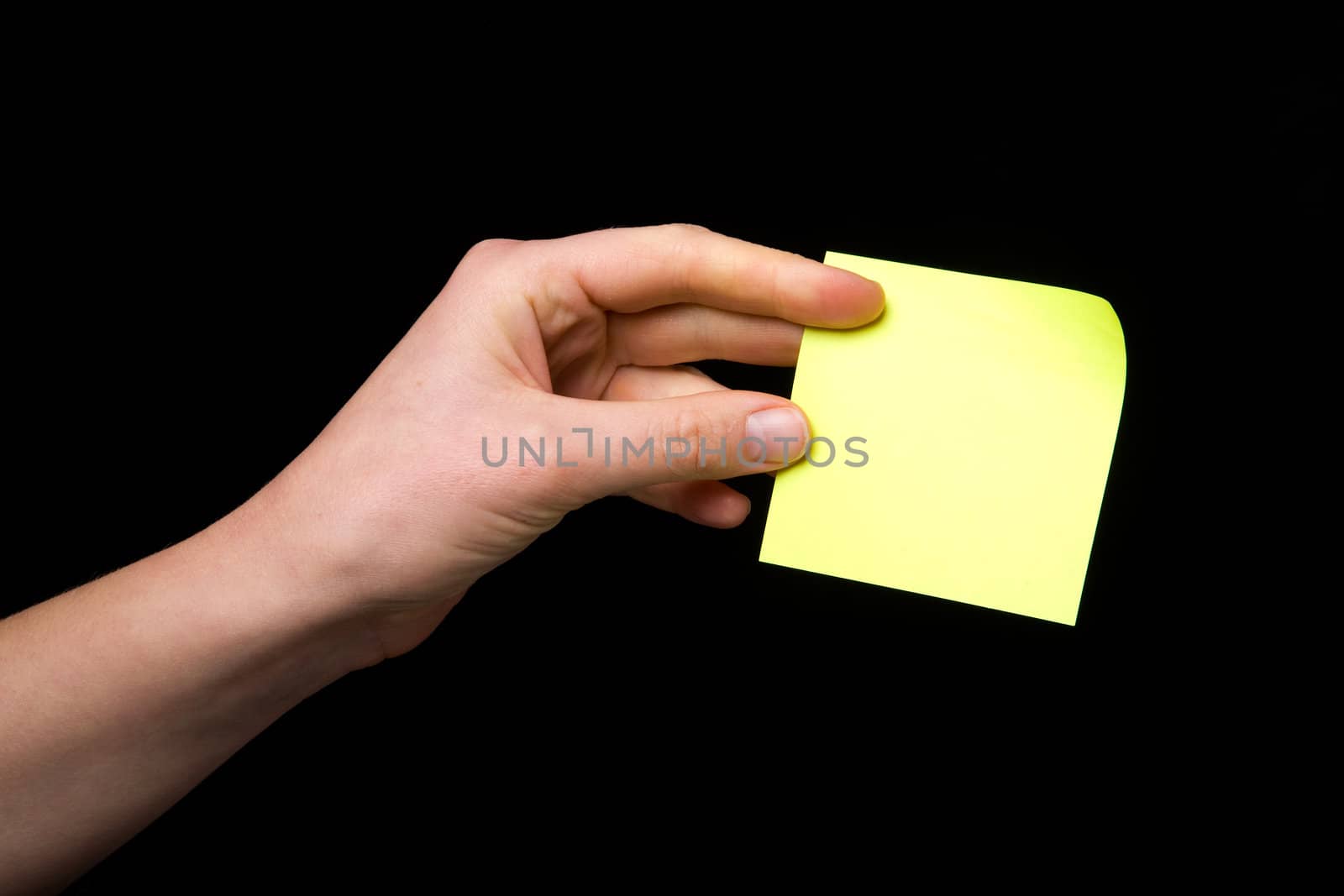 A blank sticky note stuck to a hand - remember this