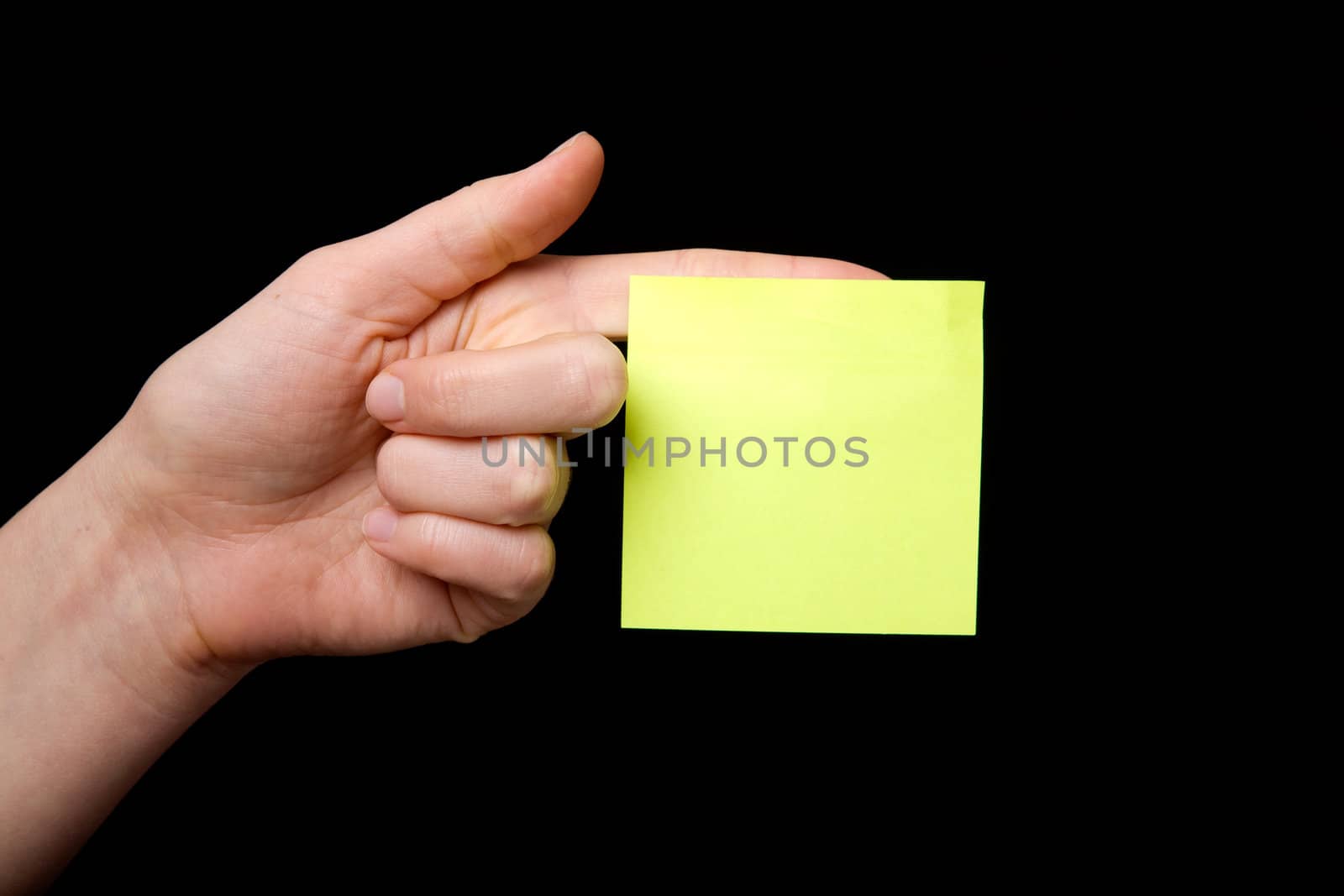 A blank sticky note stuck to a hand - remember this