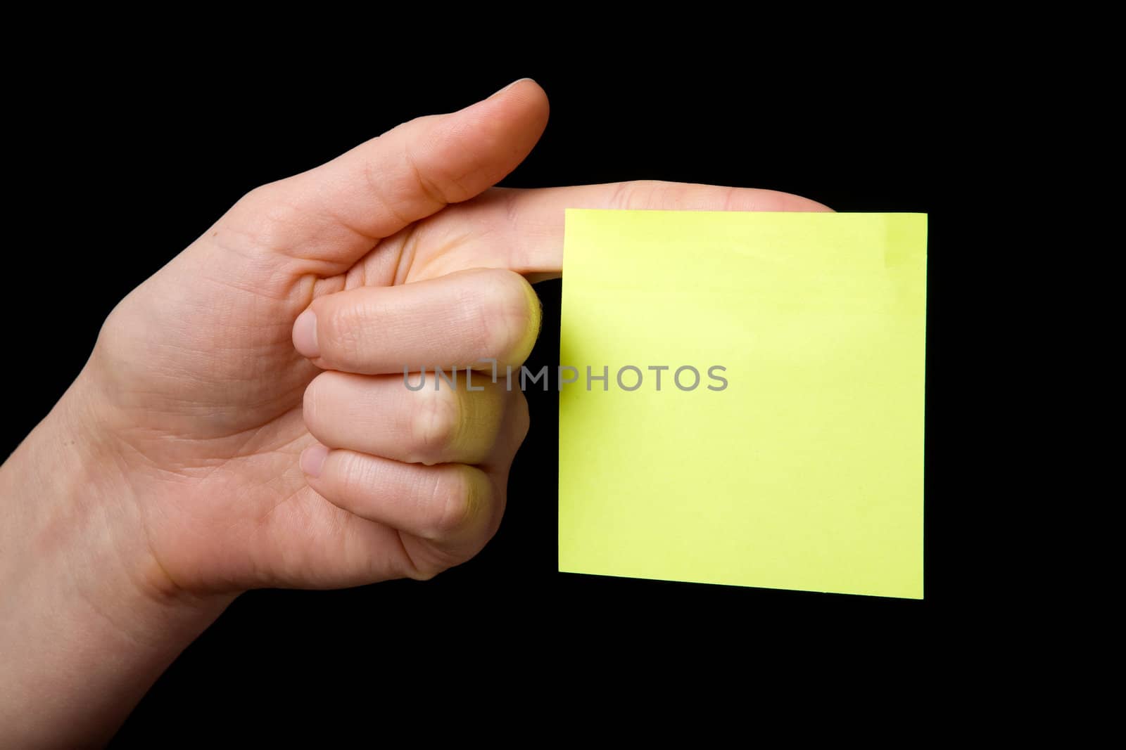A blank sticky note stuck to a hand - remember this