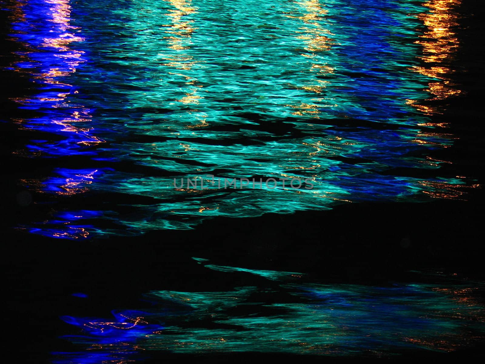 Sity light reflection on the river wave. by Vitamin