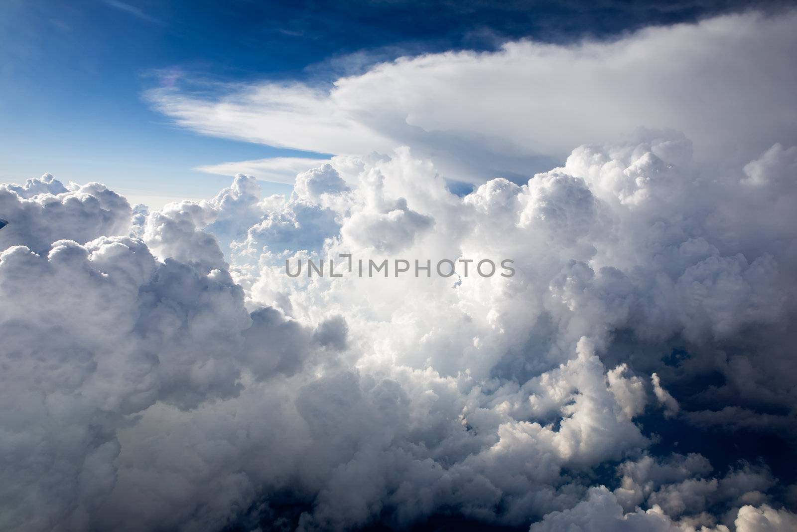 A dramatic cloudscape background with cumulus clouds