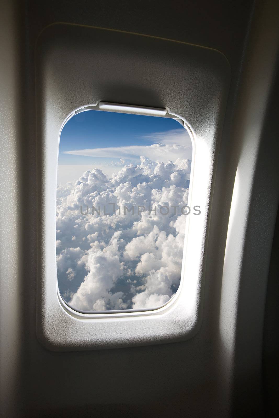 A view of clouds from an airplane window.