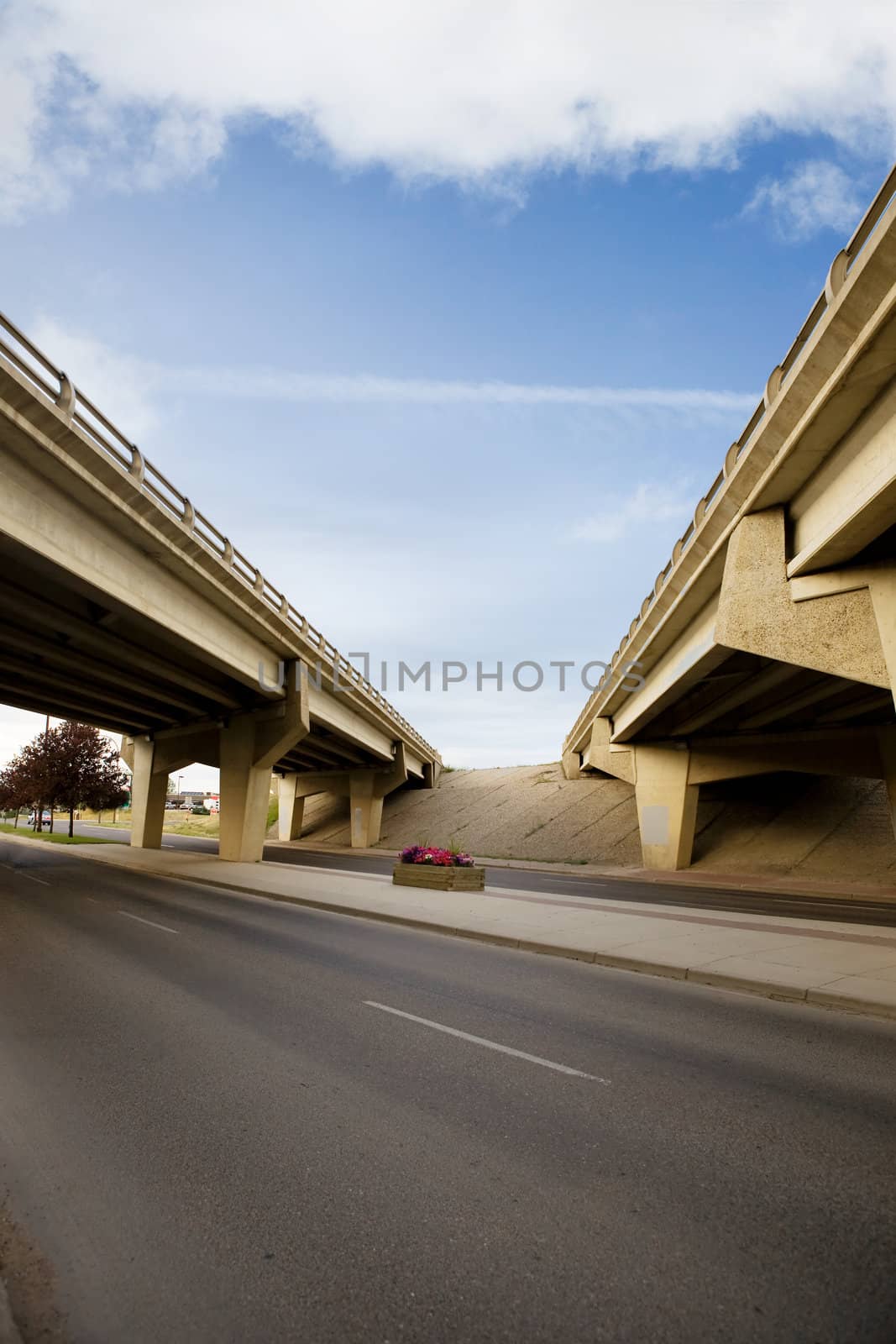 A crossing of two highways with a concrete overpass