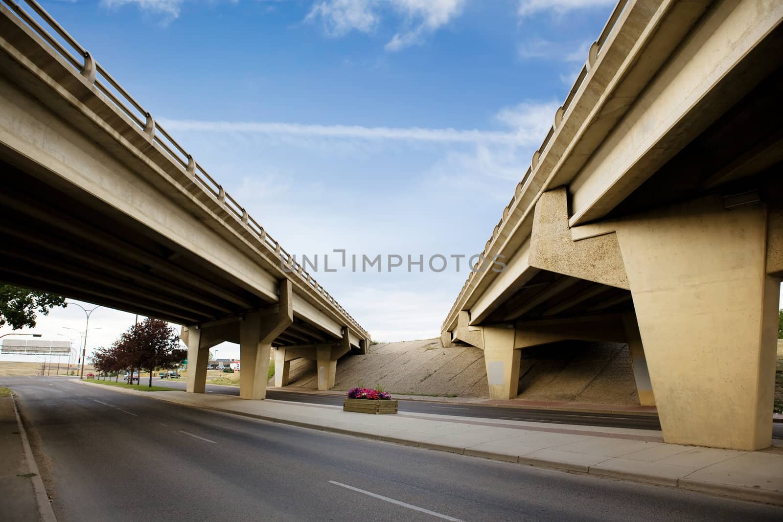 A crossing of two highways with a concrete overpass