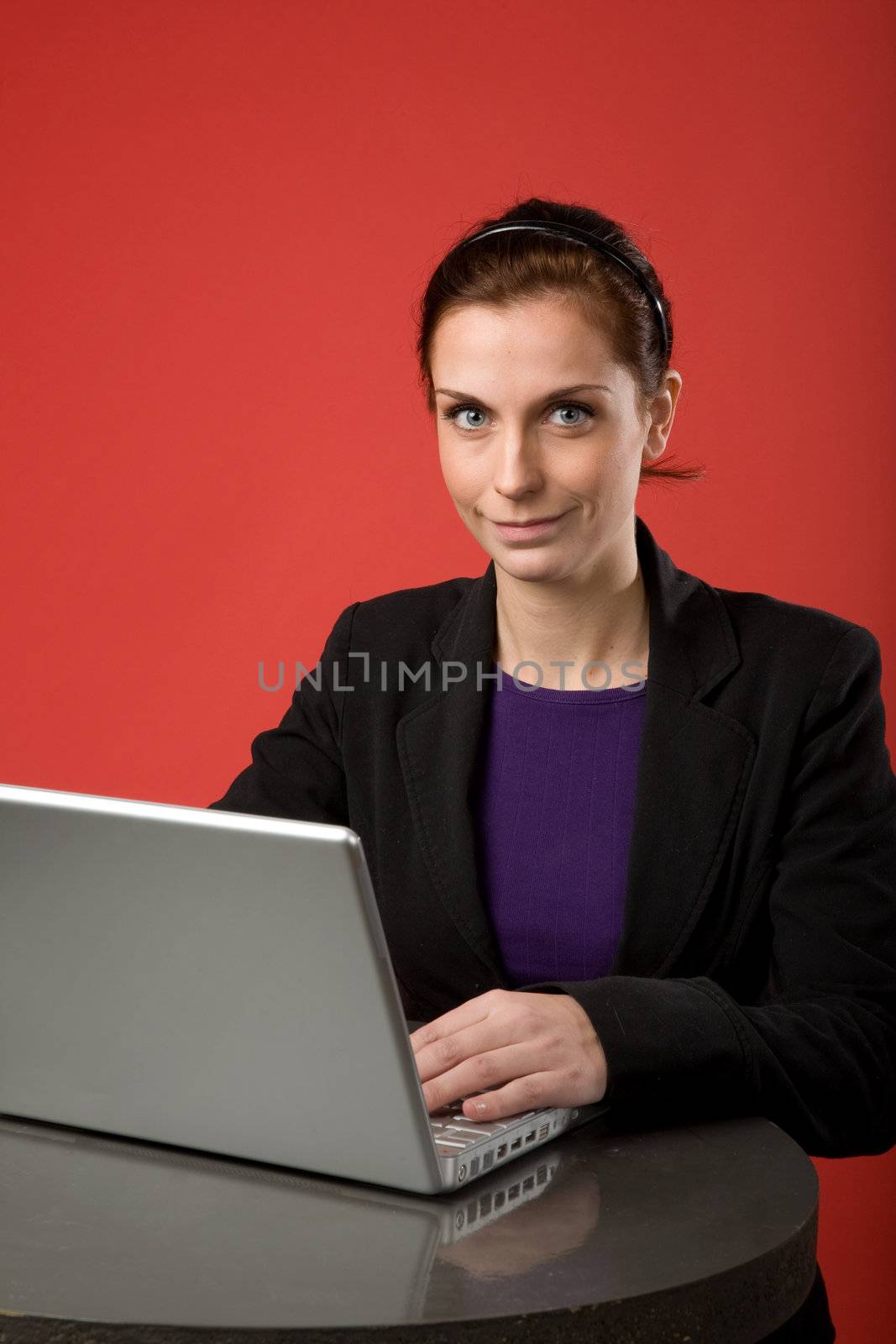 A young woman working on a latptop computer