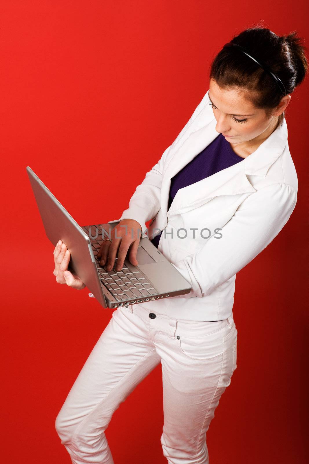 A young business woman or student using a laptop