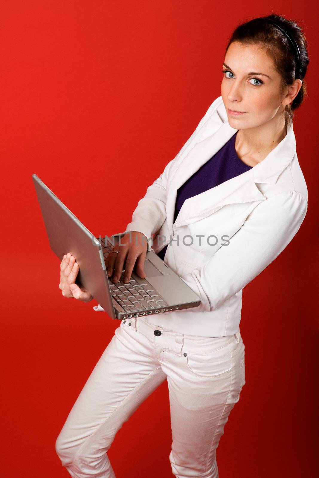 A young business woman or student using a laptop