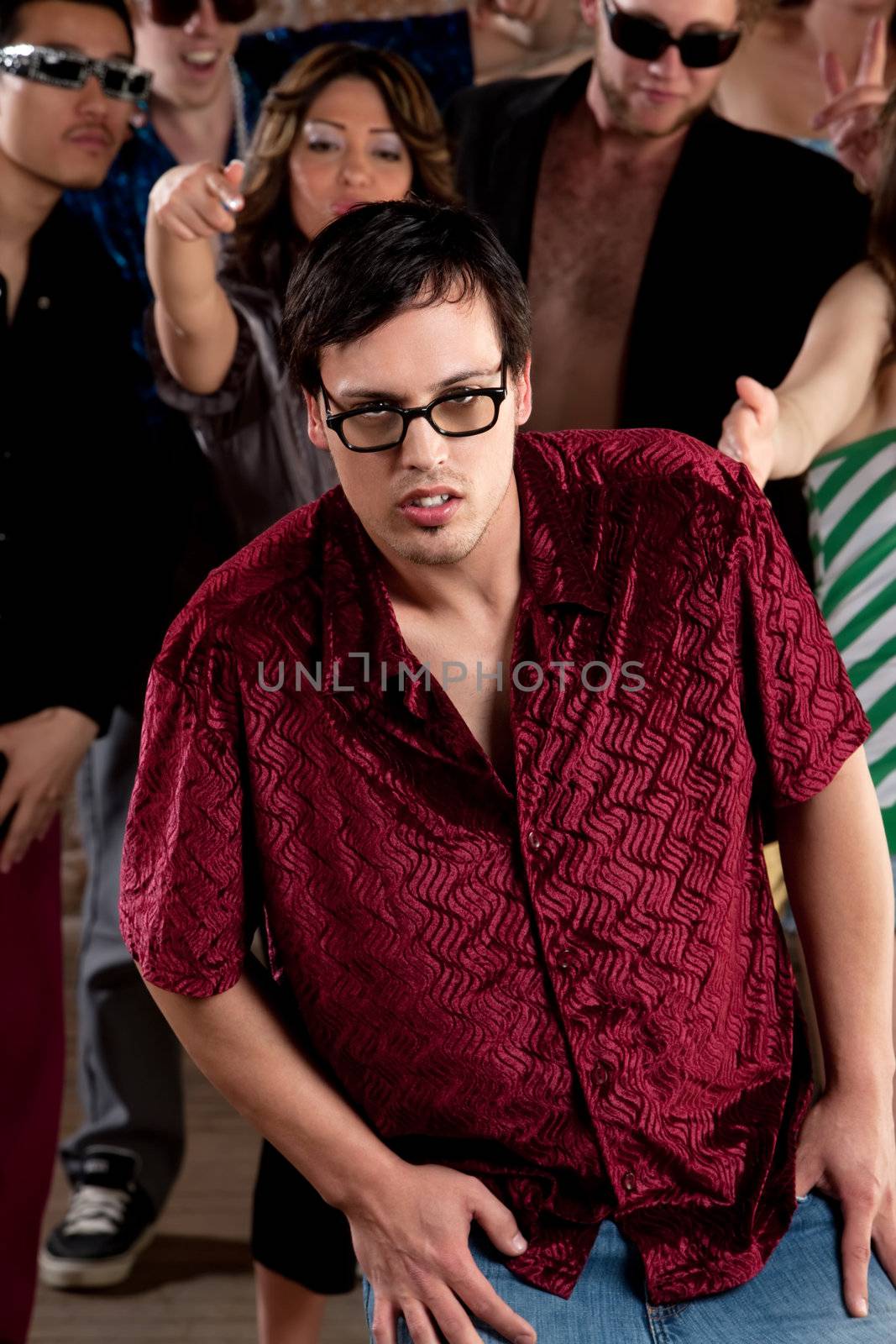 Nerdy young man stumbling at a 1970s Disco Music Party