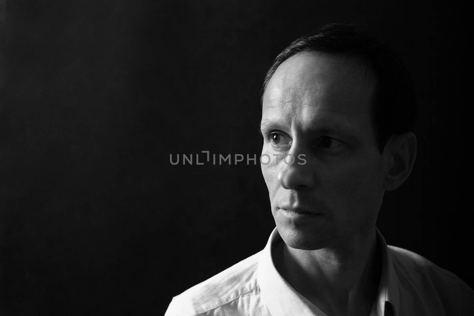 Portrait of the man on a dark background