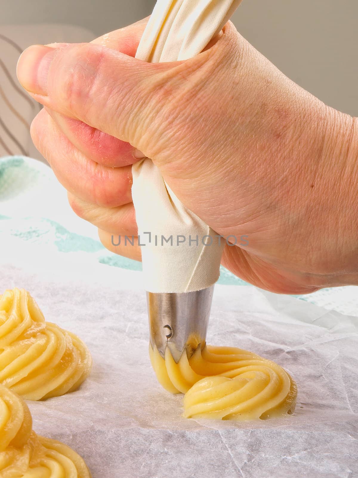 Baker making Choux pastry dough