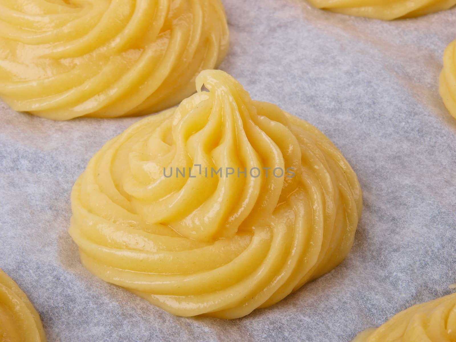 Baker making Choux pastry dough