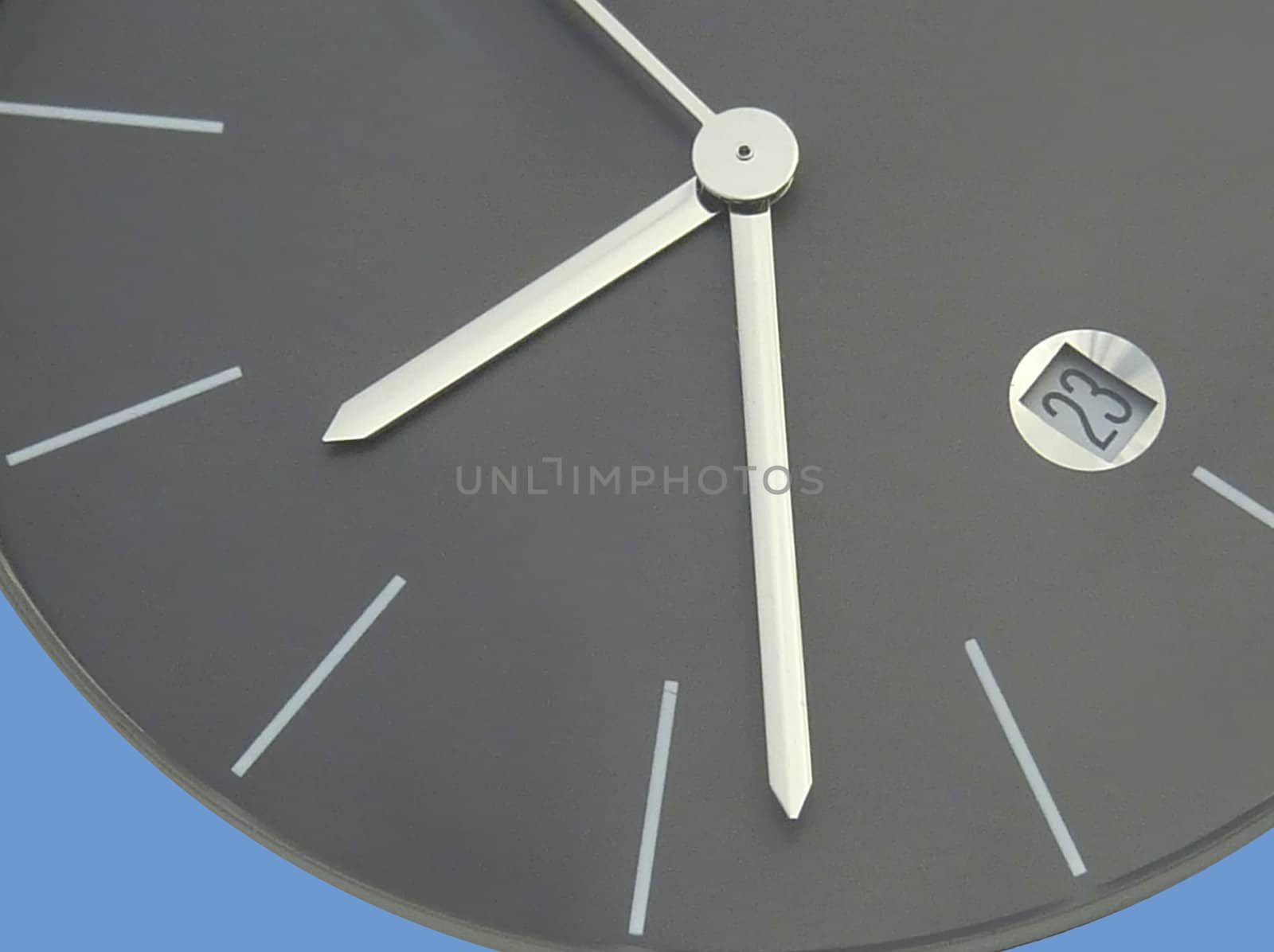 Close up of clock face over blue background