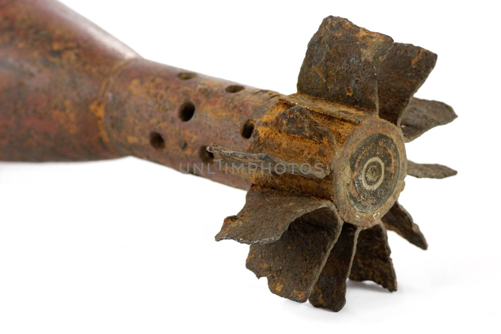 Old rusted World War II mortar shell isolated, selective focus