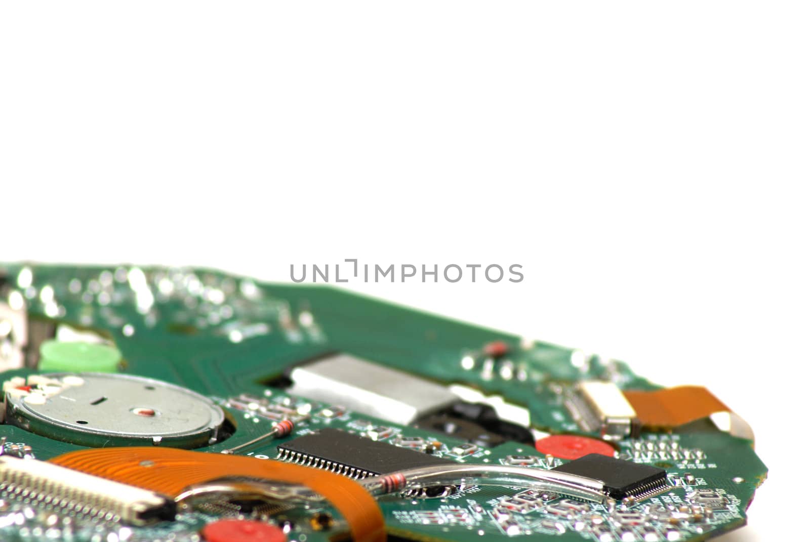 A macro shot of a circuit board from a disk playing device.