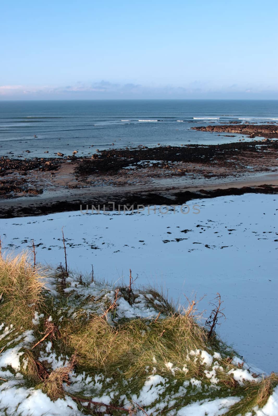 an empty rocky beach on a cold winters day