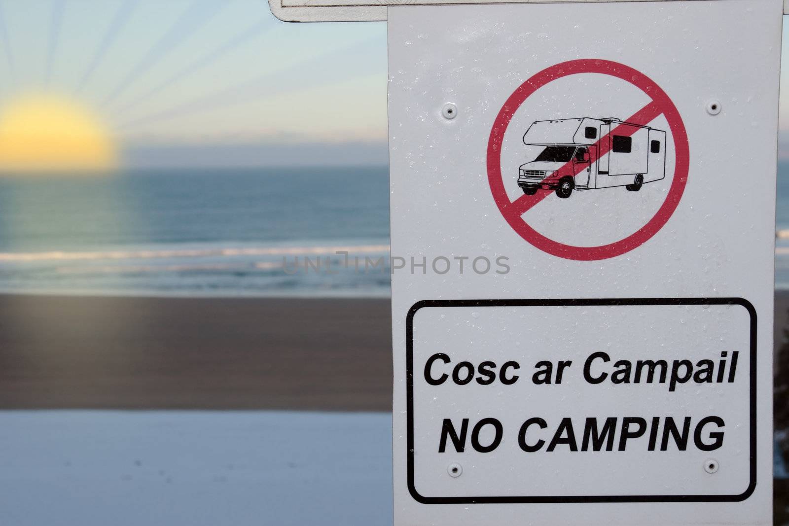 a no camping and motorhome sign in ireland at sunset