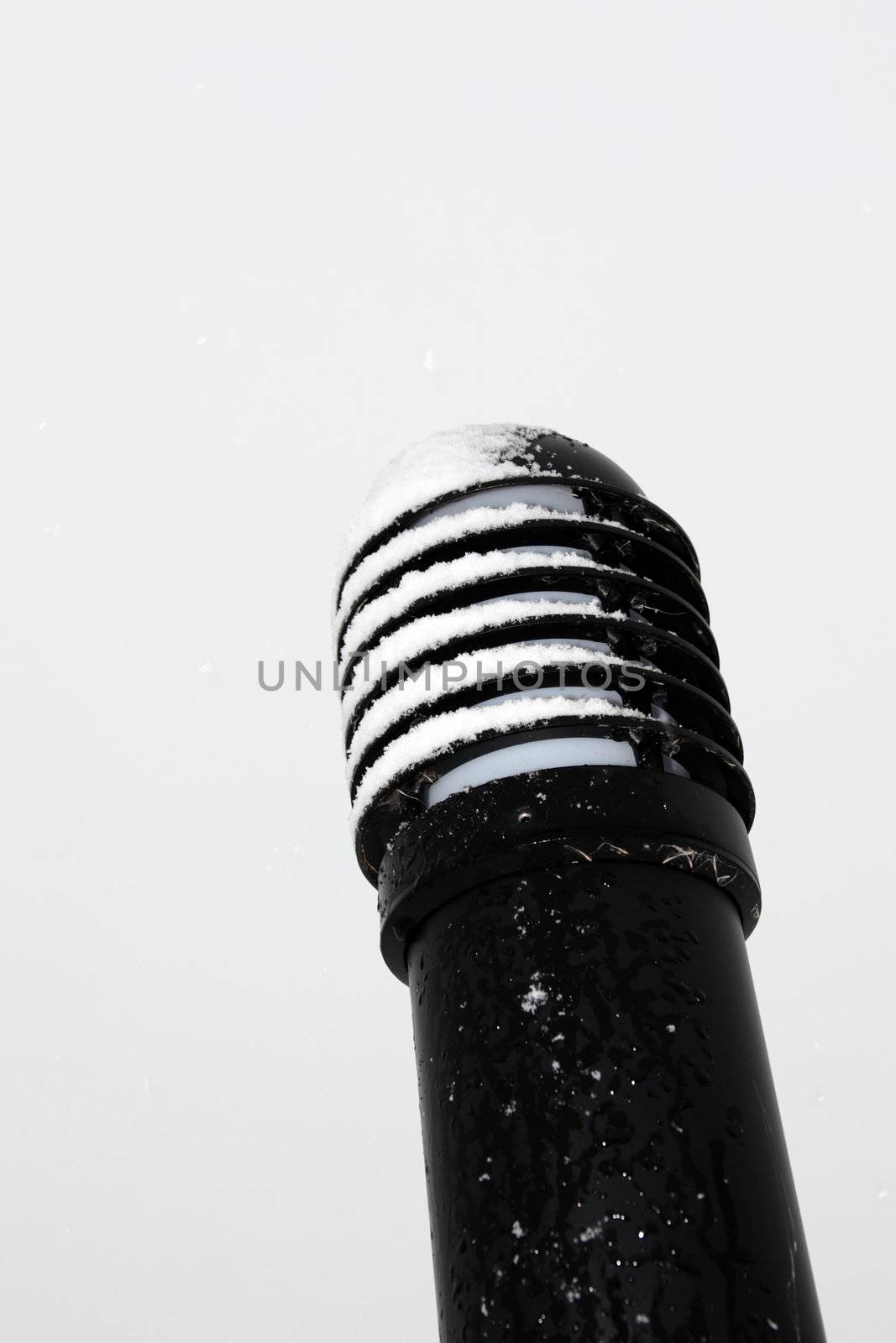 a snow covered outdoor garden electric light