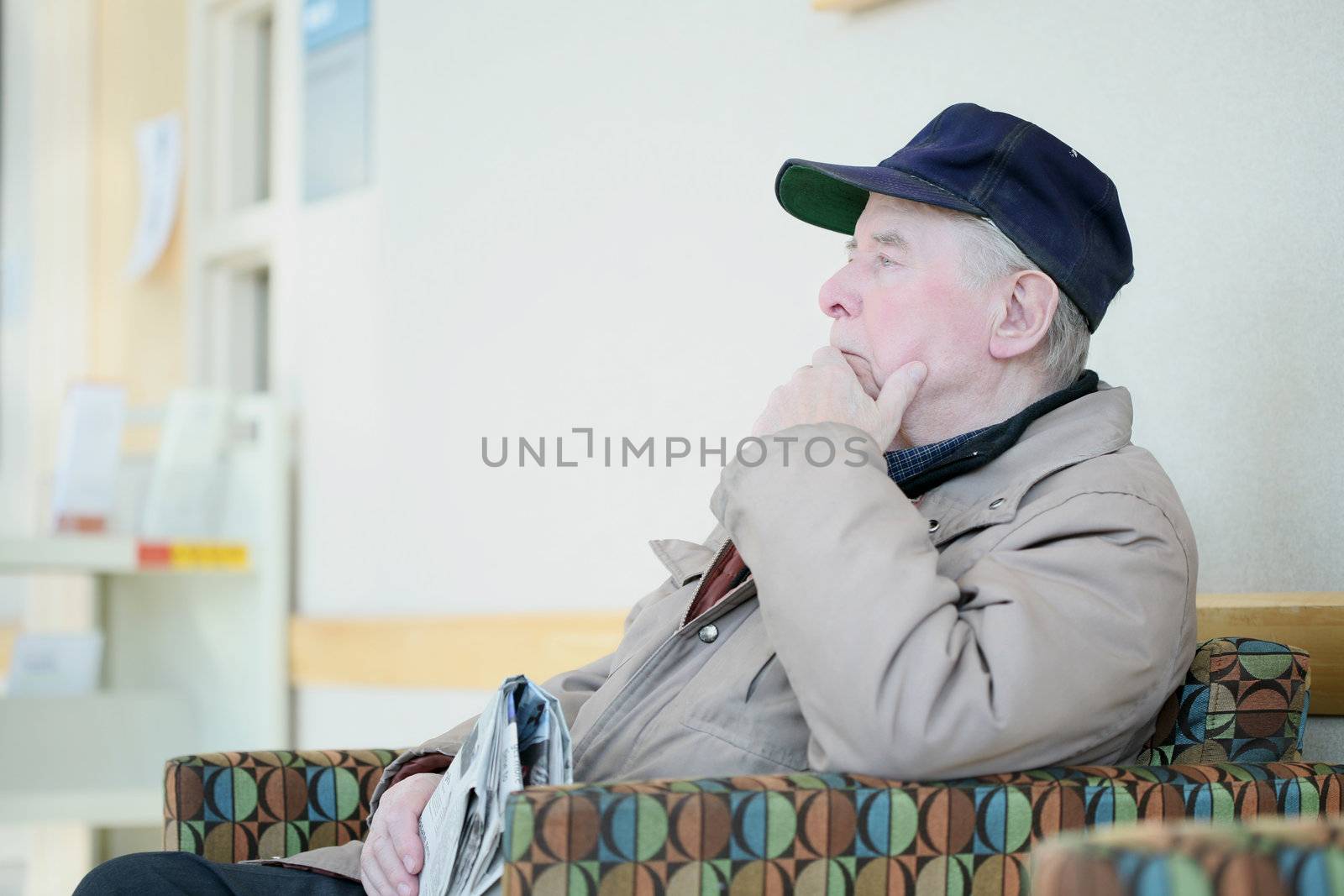 Elderly man deep in thought