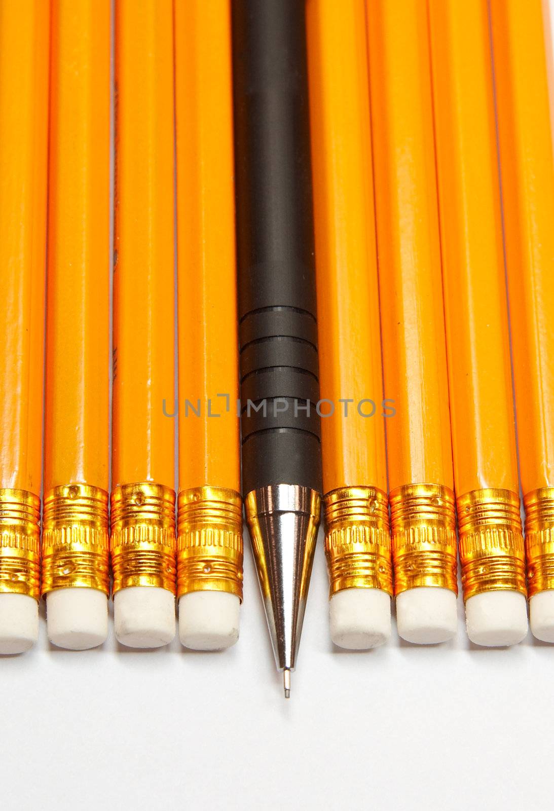 Mechanical plastic pencil among woden ones