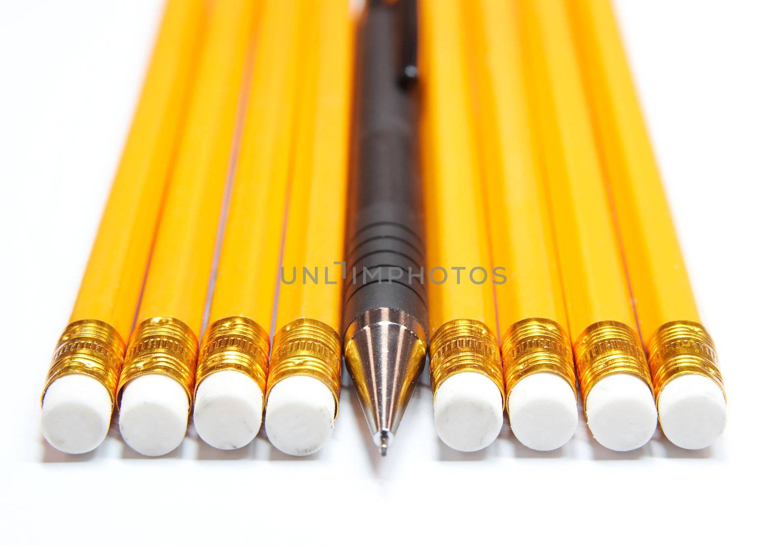 Mechanical plastic pencil among woden ones
