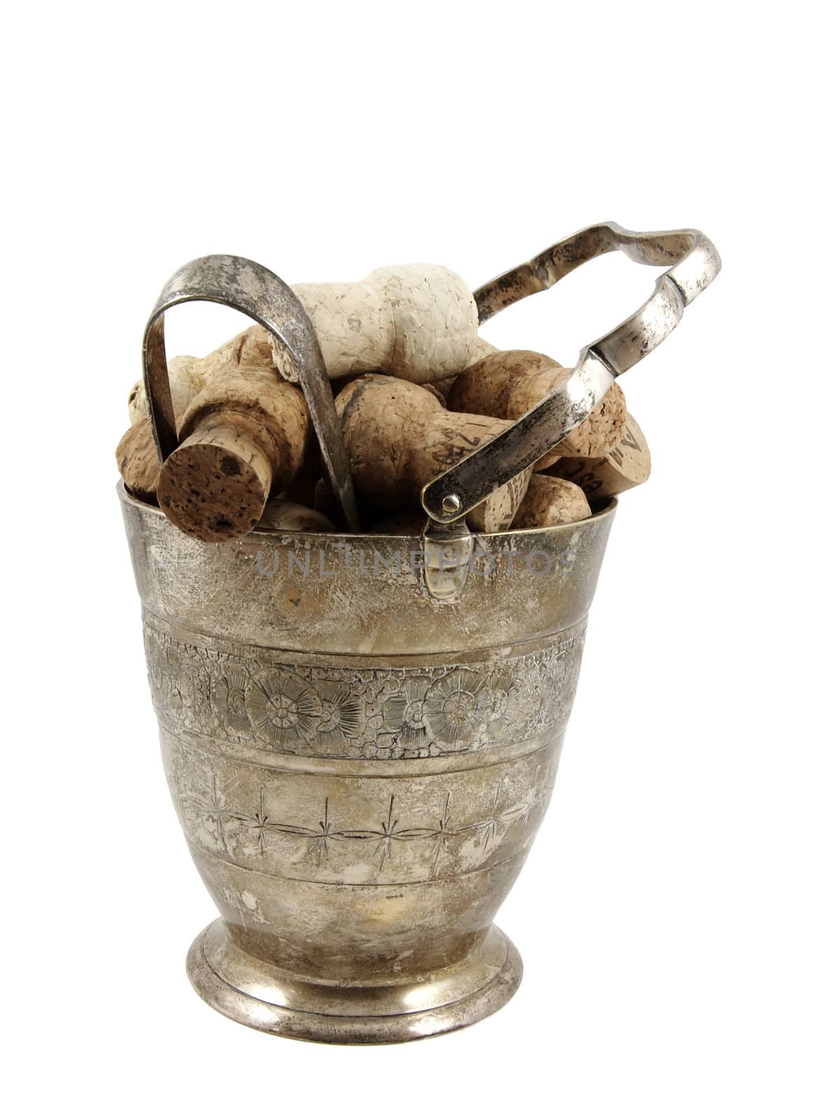 Ice bucket filled with champagne corks isolated over white background