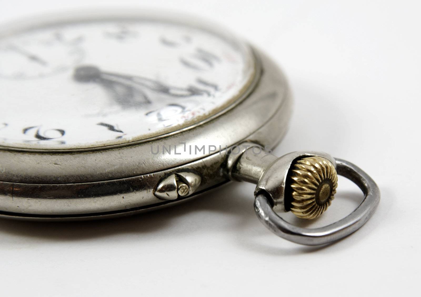 Detail of ancient silver watch isolated by serpl