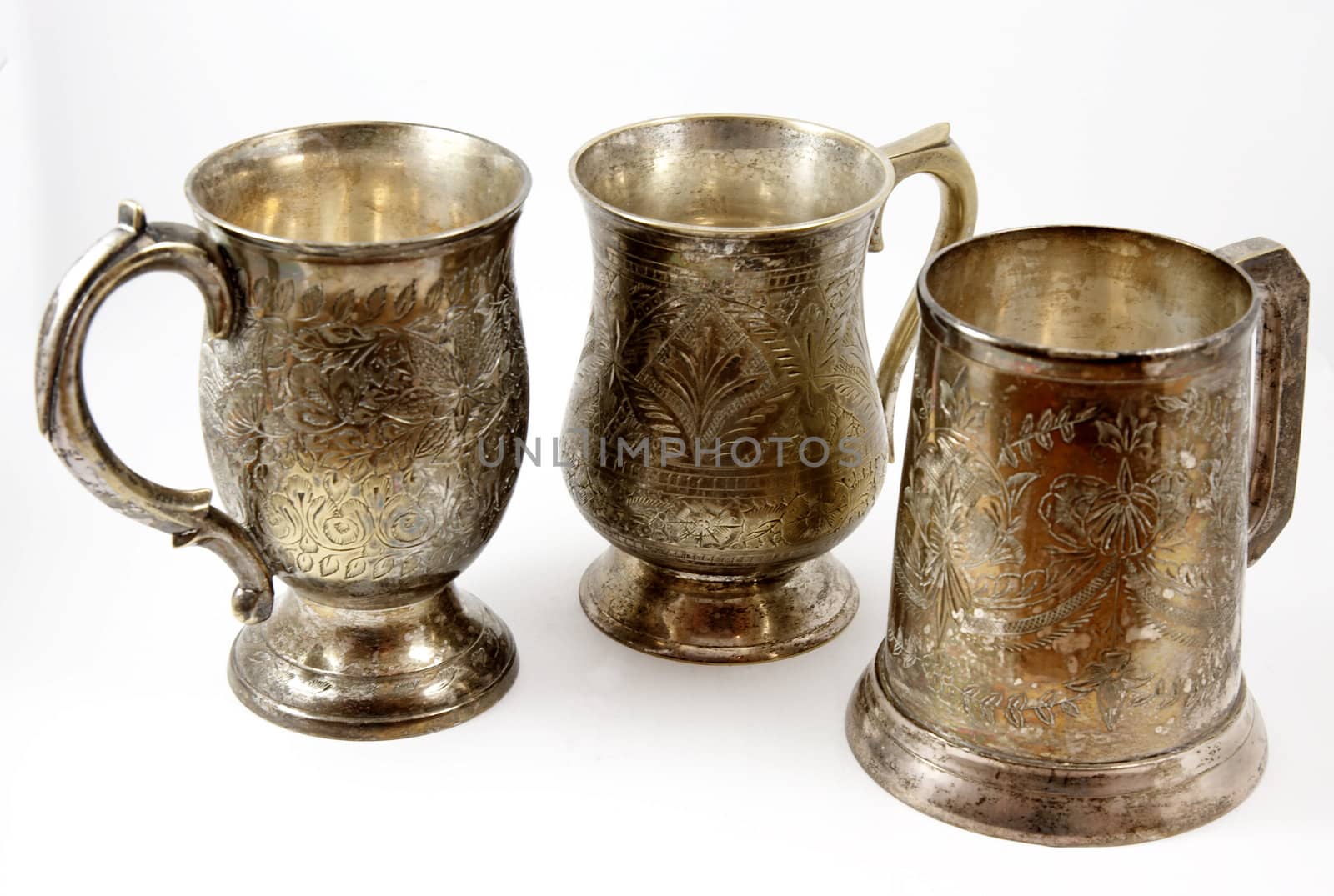 Three silver beer tankards isolated  by serpl