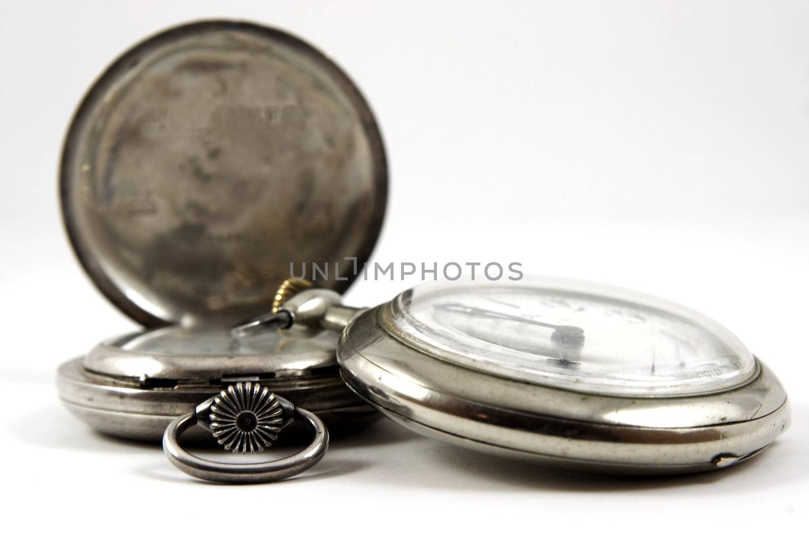 Two antique silver watches isolated over white background