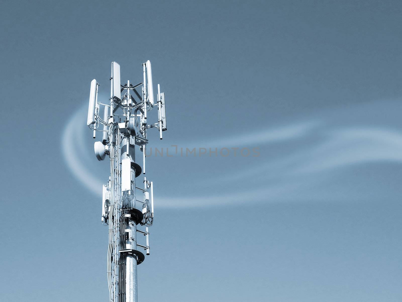 Closeup of transmitter tower overlaid with smoke effect. Blue toned.