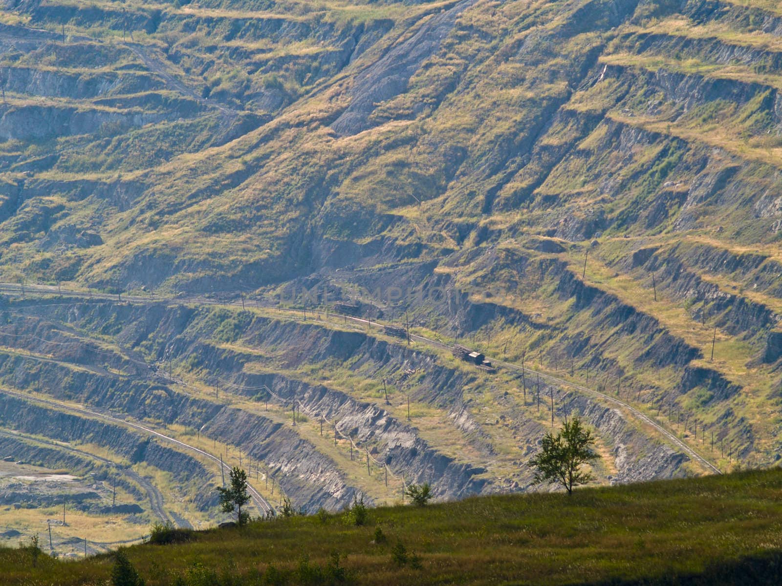 terraces of open-pit mine. by liseykina