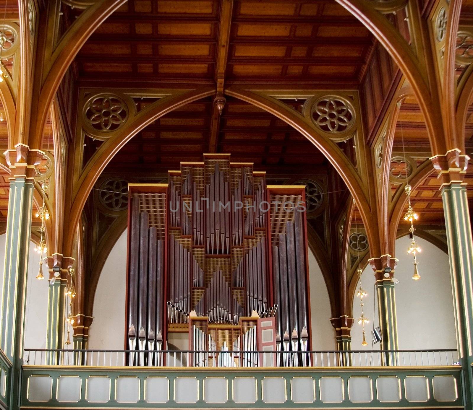 A pipe organ in an old wooden church