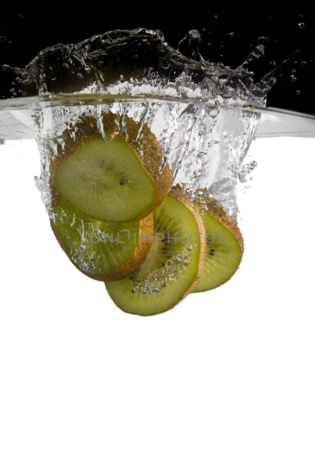 Kiwifruit slices in water by RobStark