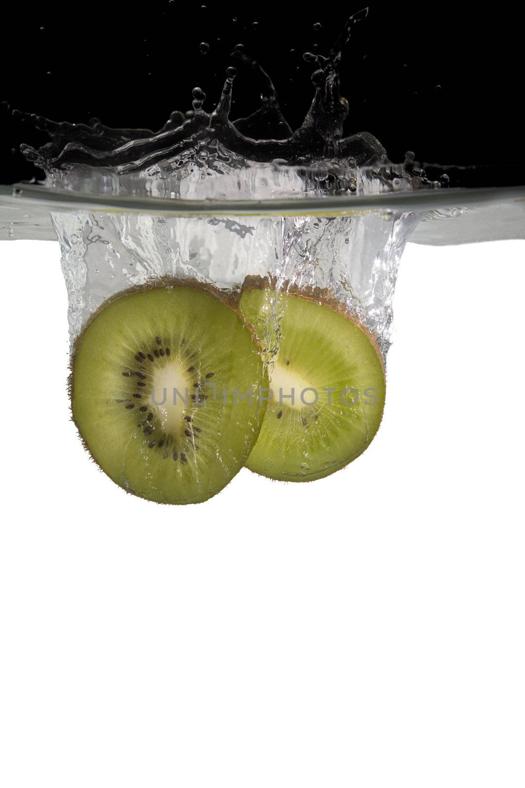 two slices kiwifruit in water by RobStark