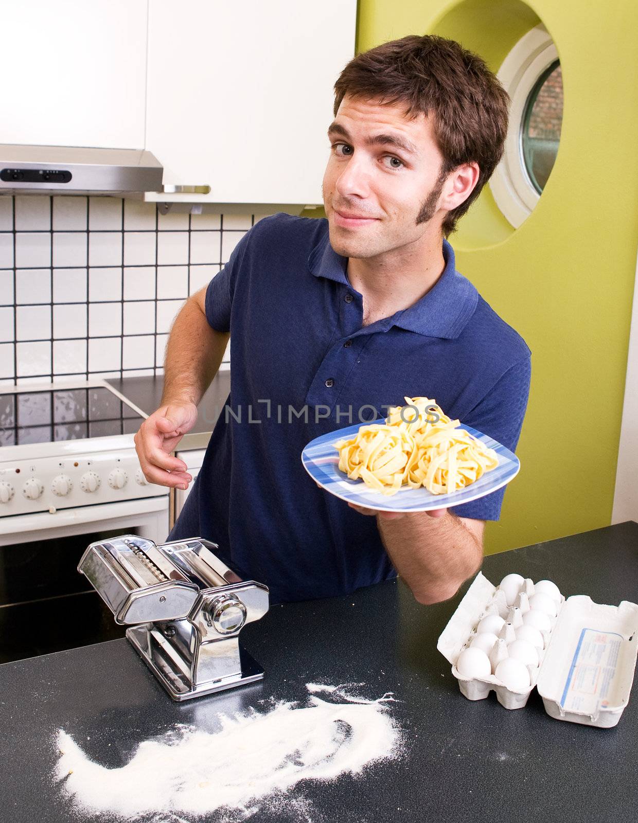 A detail of homemade fettuccine on a plate ready to be boiled