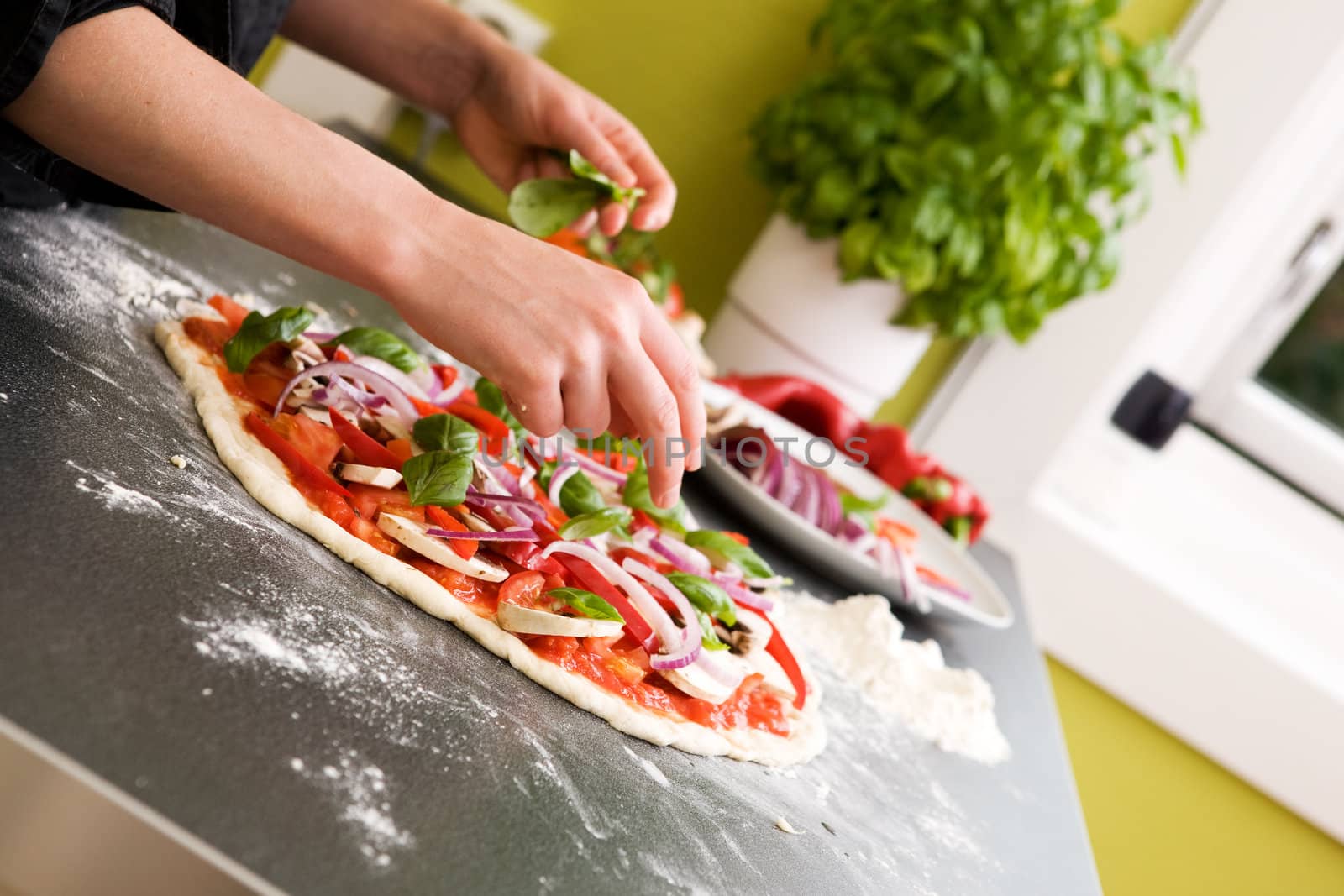 Italian style vegetarian pizza on the counter waiting to be baked.