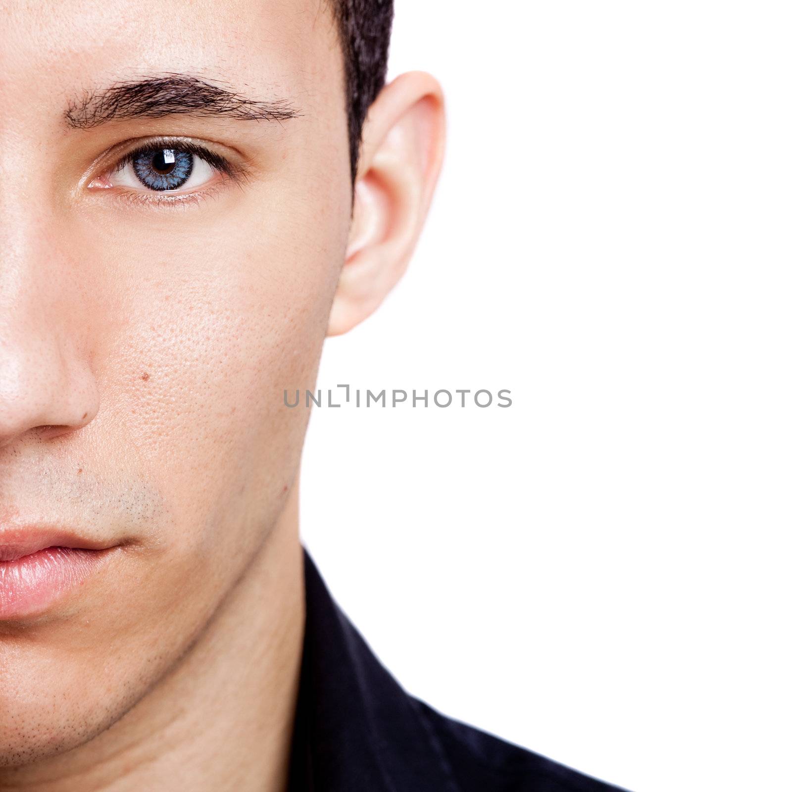 Fashion portrait of a young man with blue eyes isolated on white background
