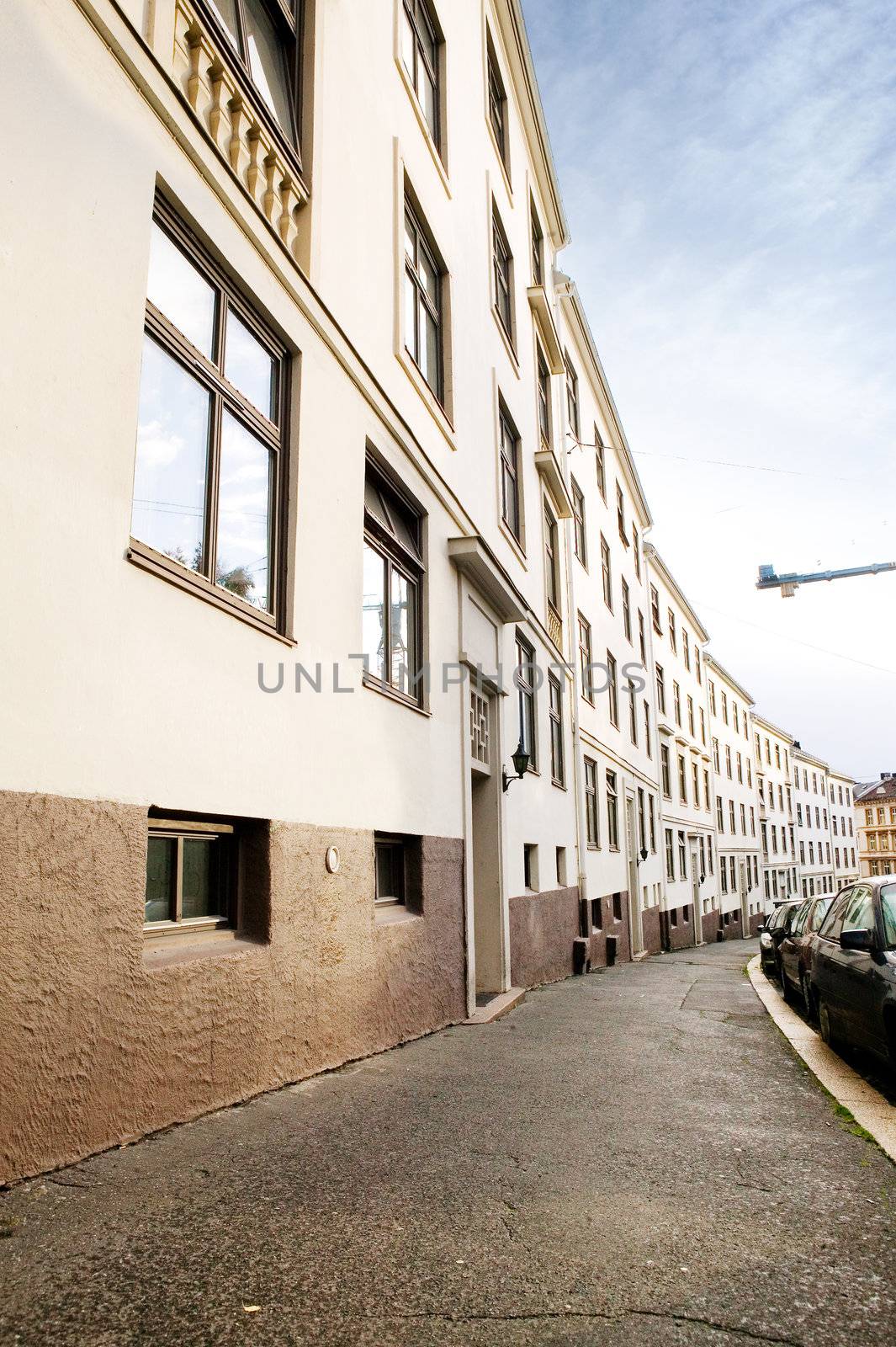 A row of similiar buildings on a tight street in Oslo Norway