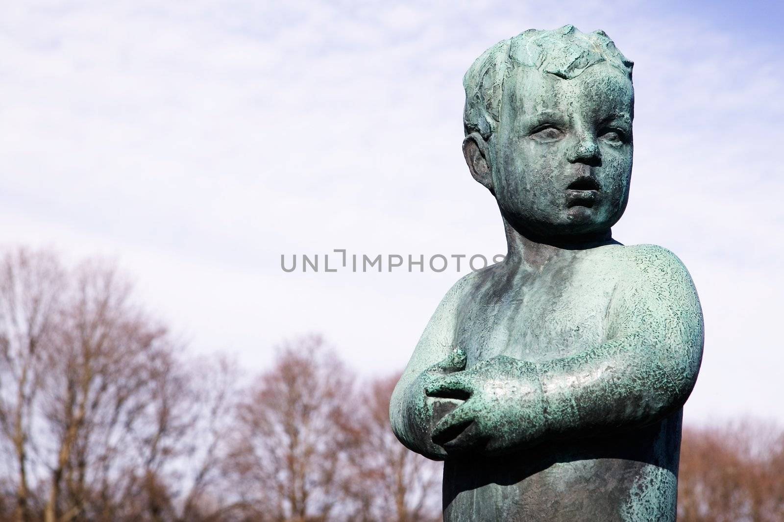 A statue of a worried little boy at the vigeland park, Oslo Norway.
