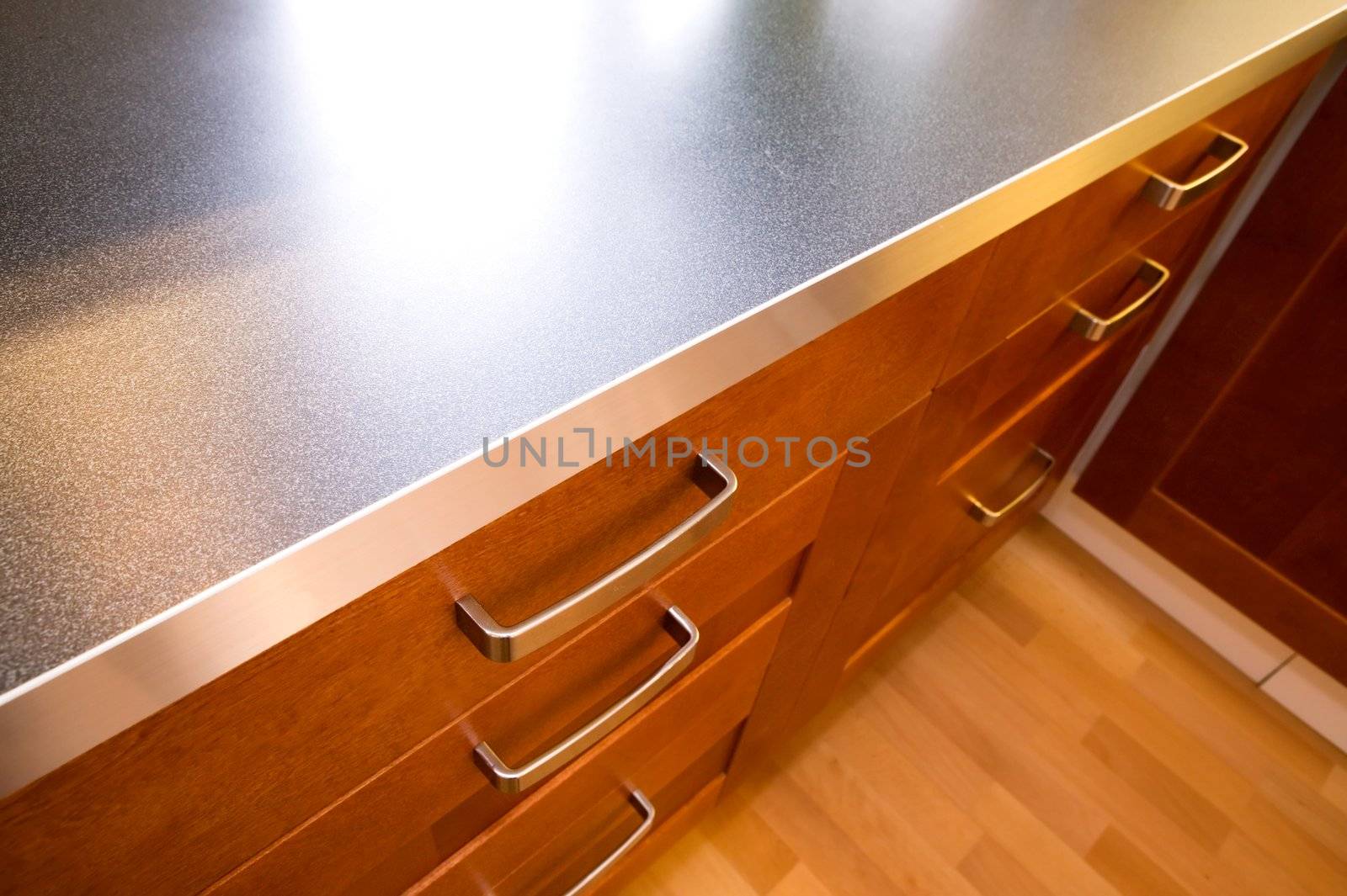A detail close up image of a stylish kitchen counter and drawer.