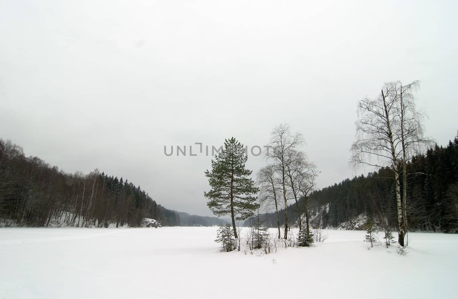 A lake near Oslo, Norway during the winter on a cloudy dismal depressing day.