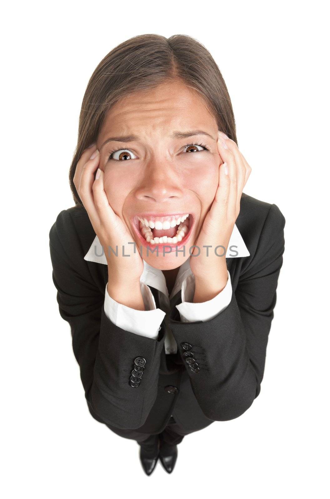 Funny businesswoman with stress isolated. High angle view fish eye like image of stressed young woman in suit, Isolated on white background. 