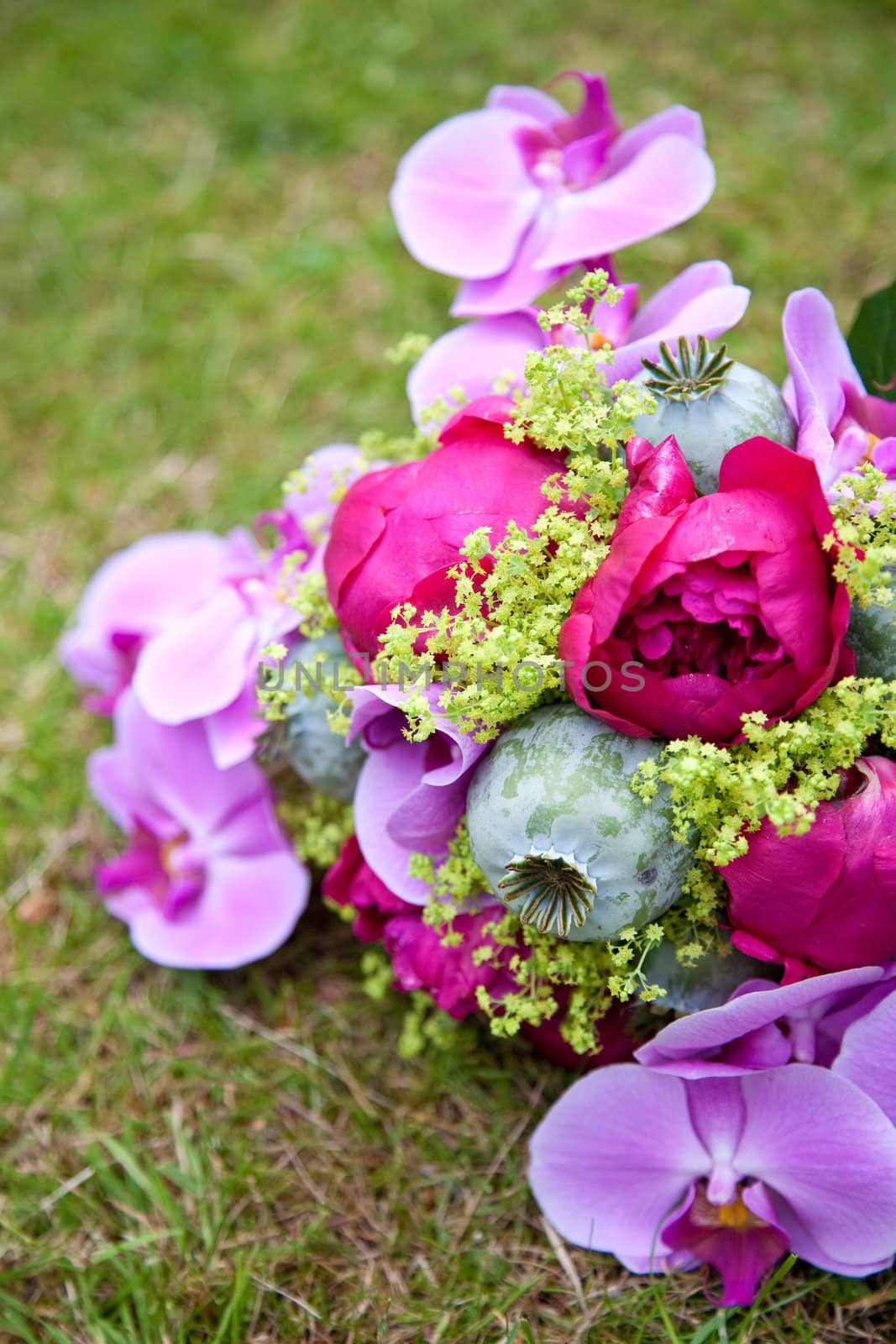 Beautiful colorful weddingbouquet with orchids and roses