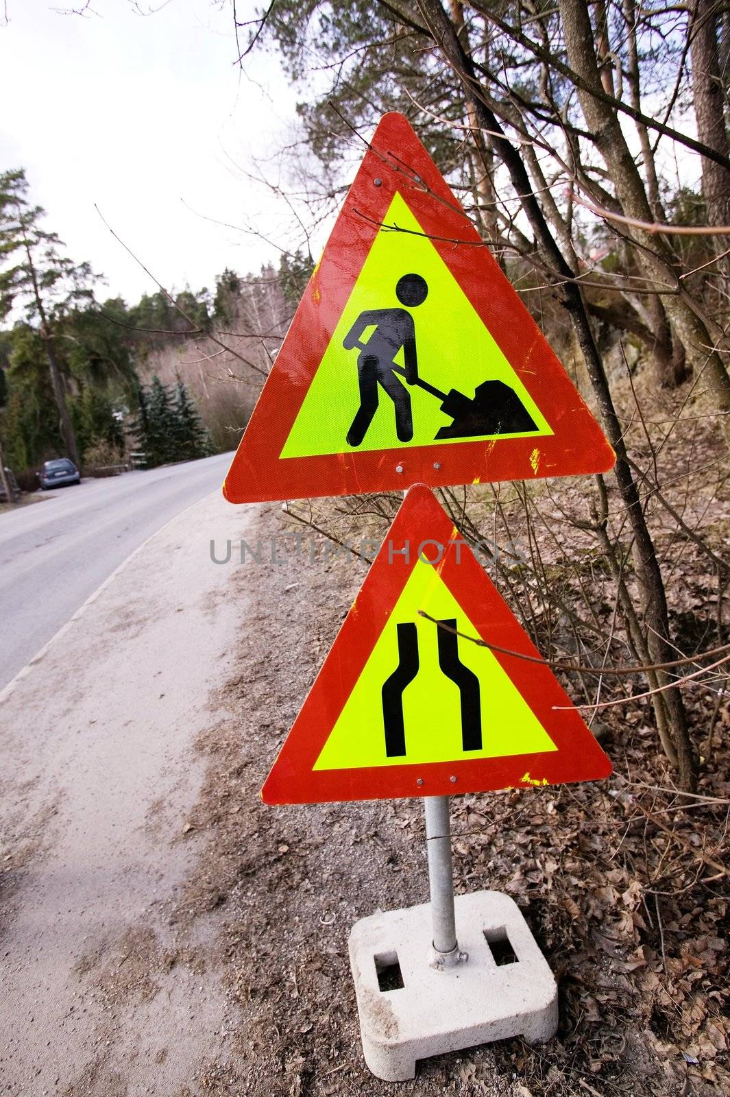 A construction sign on the side of the road.