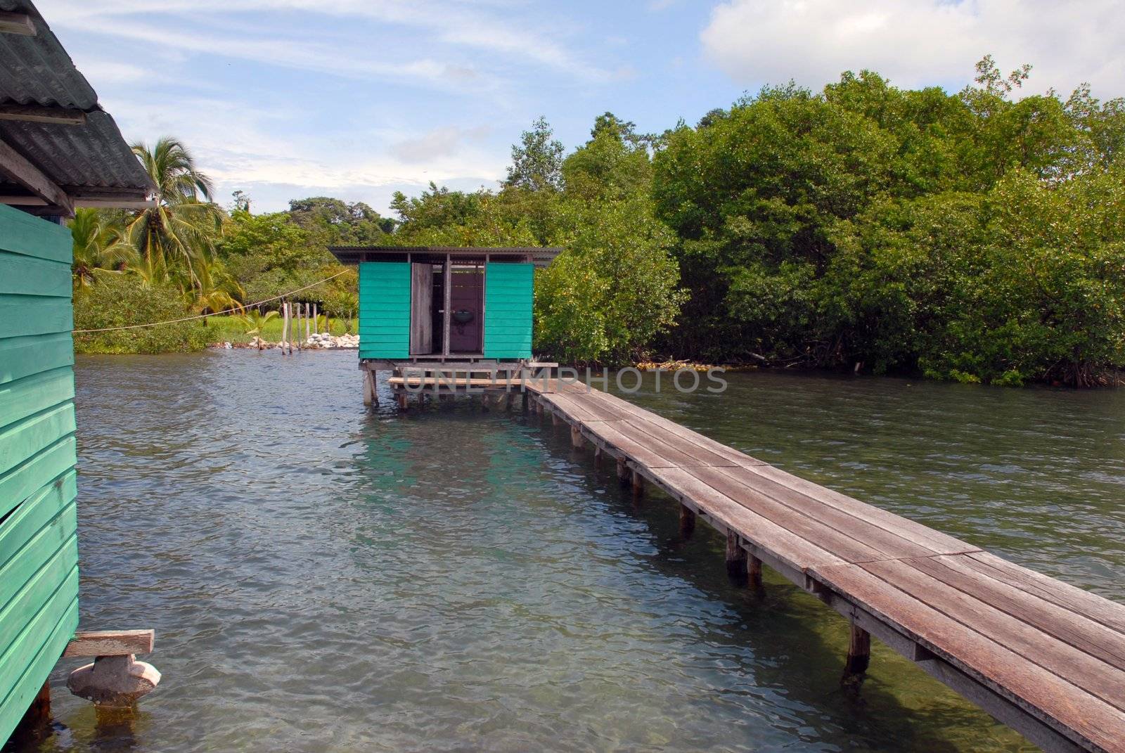 Small wooden house at the end of the bridge