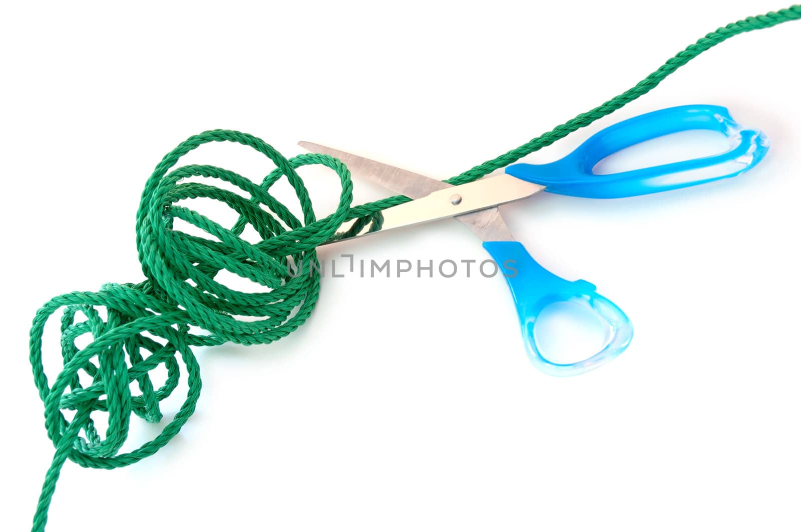 Green synthetic cord and steel scissors on overwhite background.