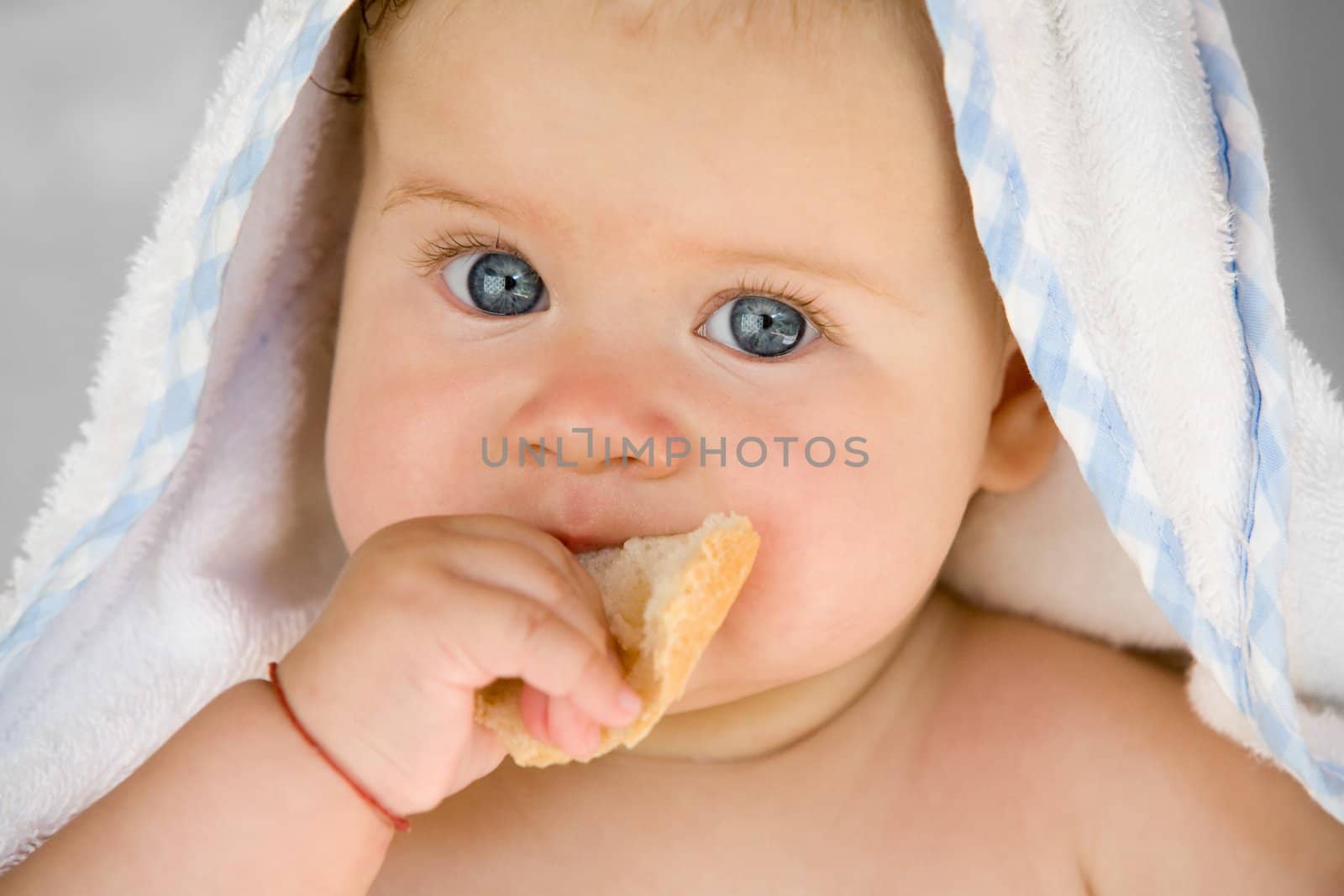 people series: portrait of adorable baby with bread