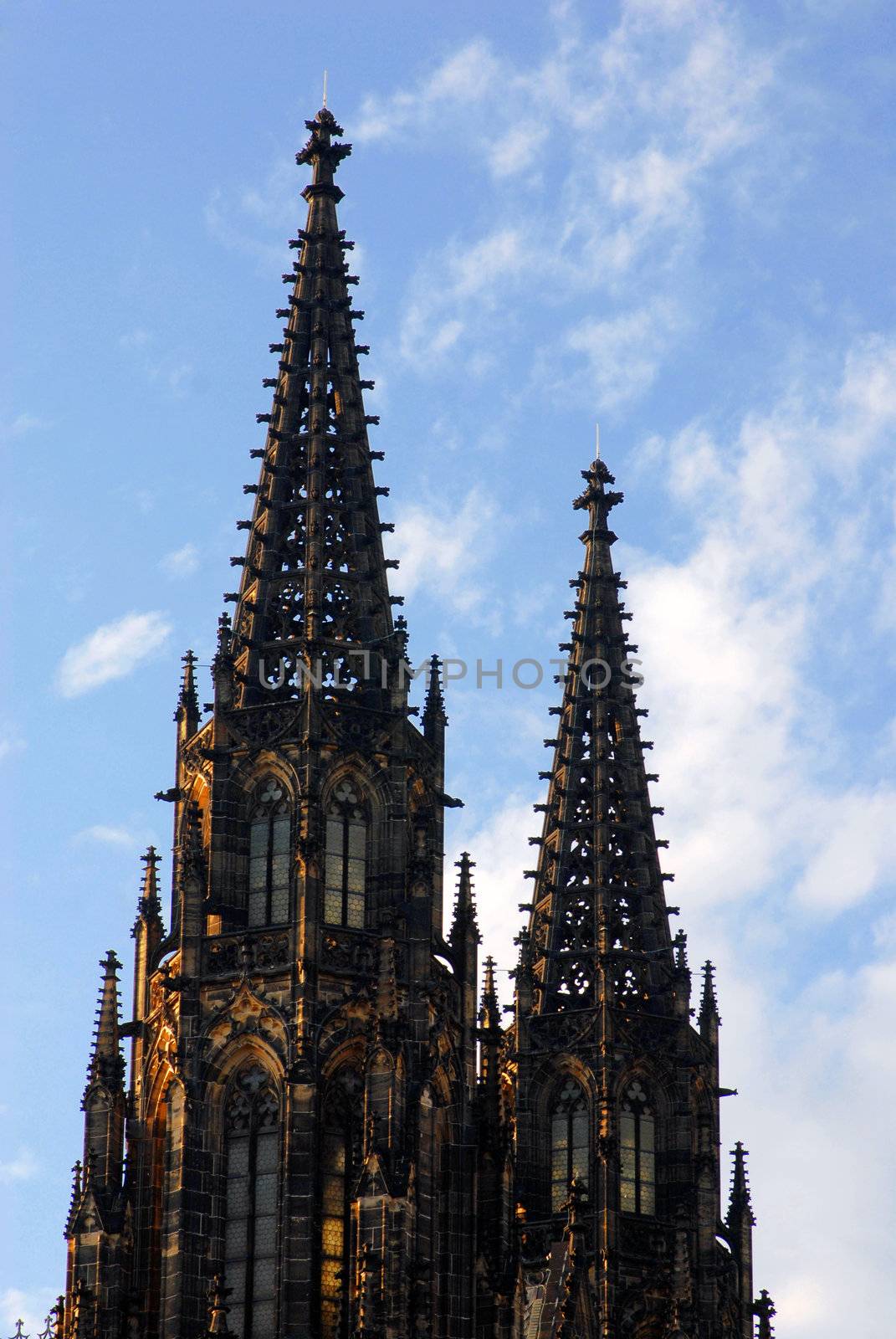 Gothic church towers in a blue sky. Prague.