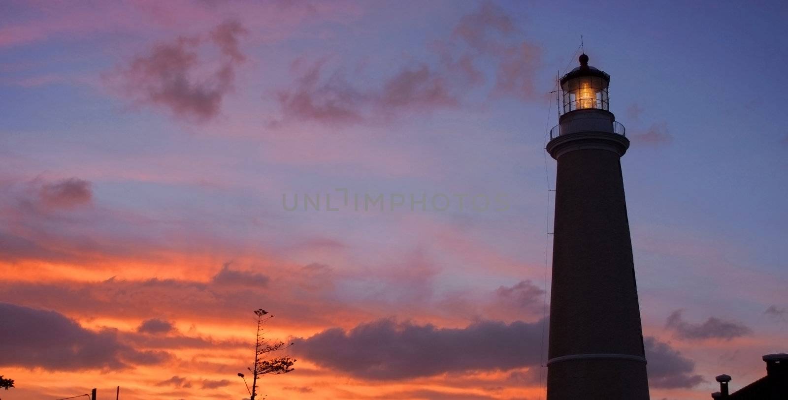 Lighthouse at dusk in Punta del Este  by cienpies