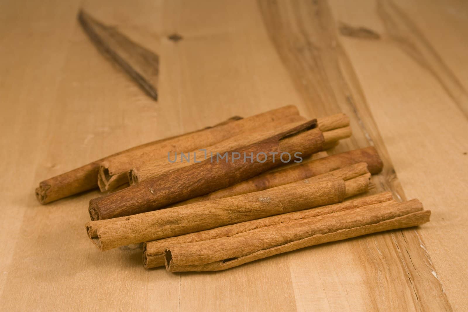 Cinnamon sticks on wood