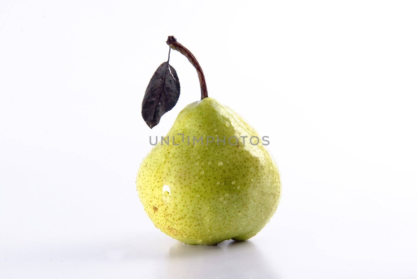 Ripe juicy pear covered by drops of water. Isolation on white, shallow DO.